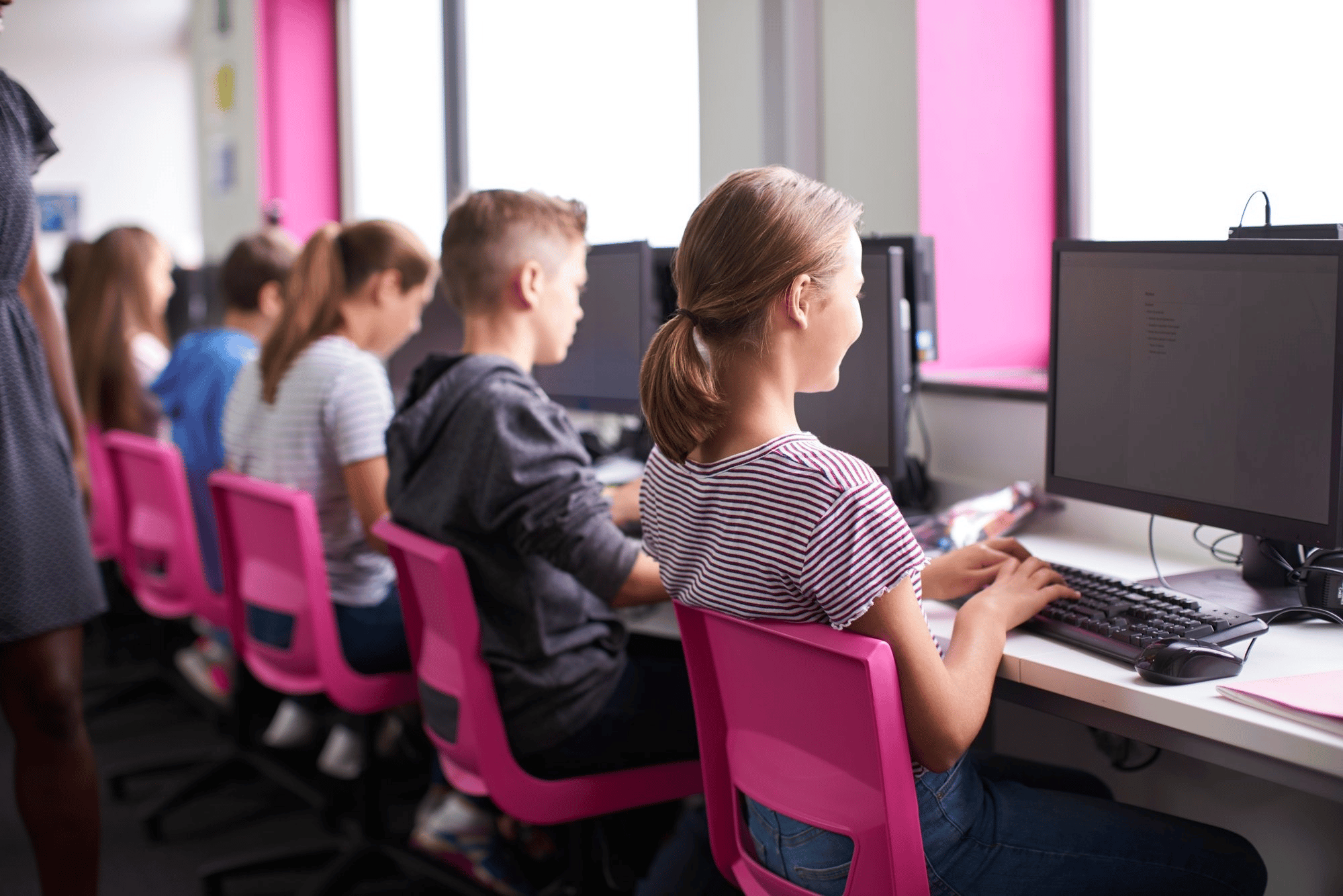 female-teacher-teaching-computer