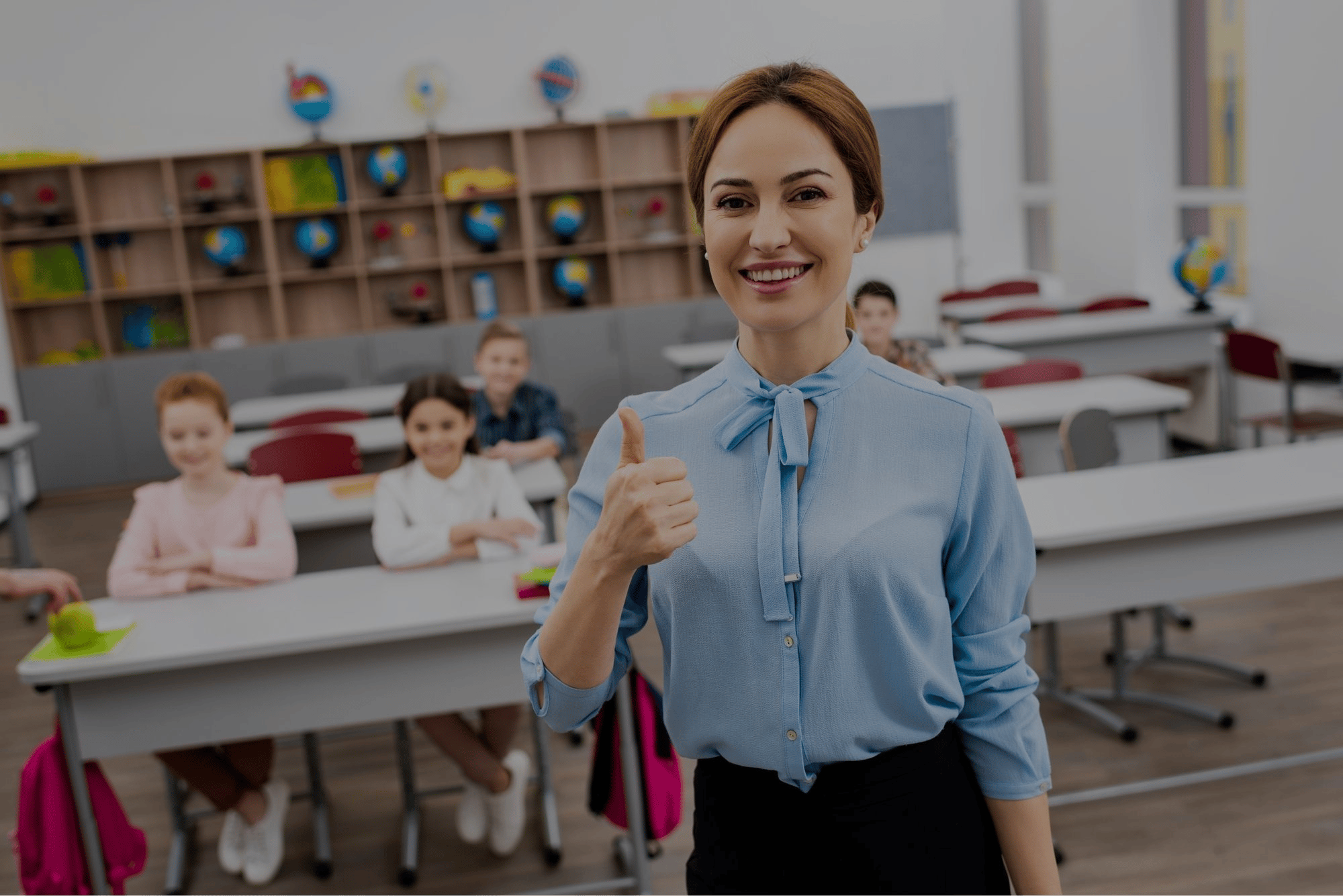 laughing-teacher-in-blue-blouse