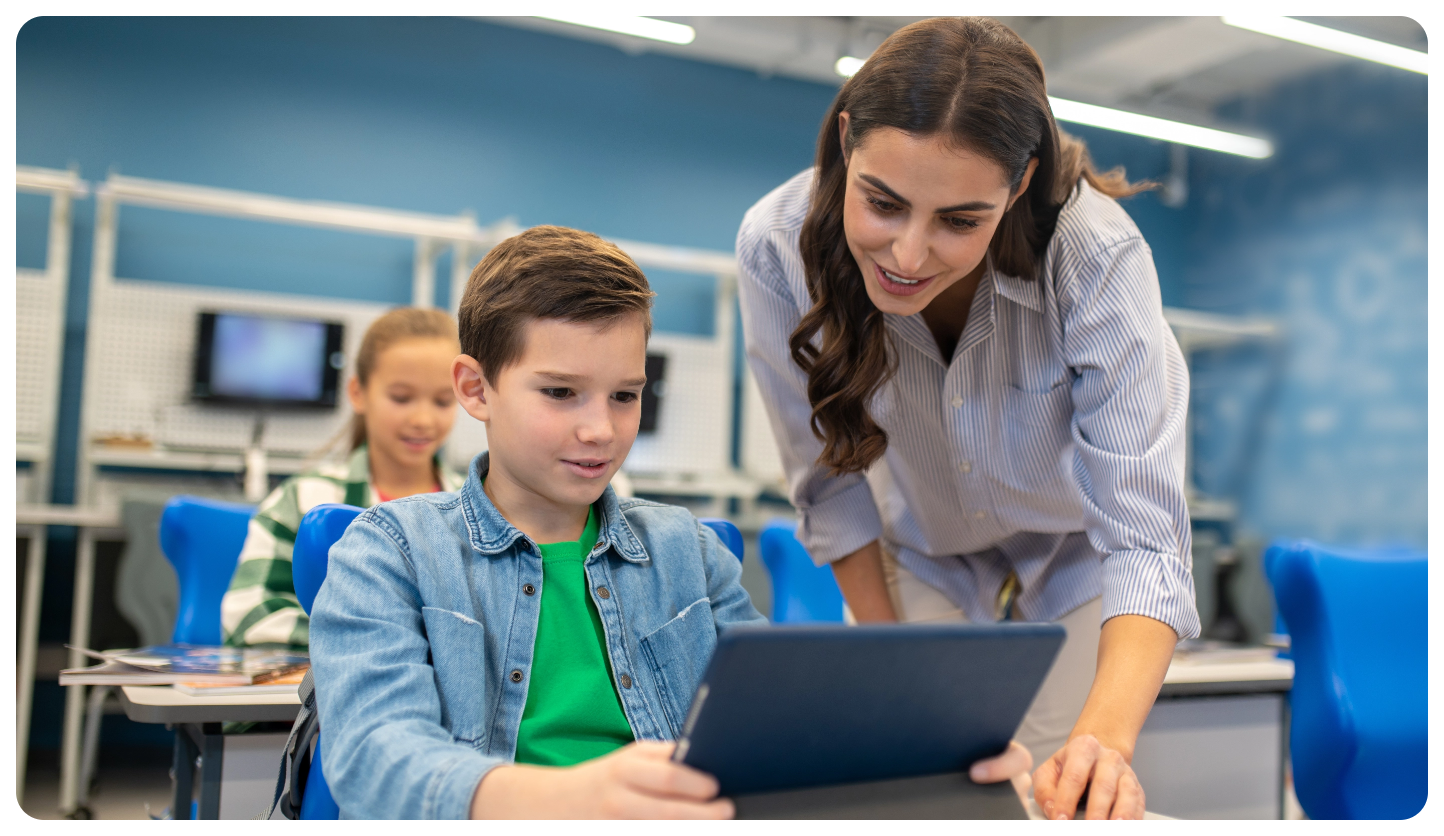 woman-looking-into-tablet-student-boy@2x